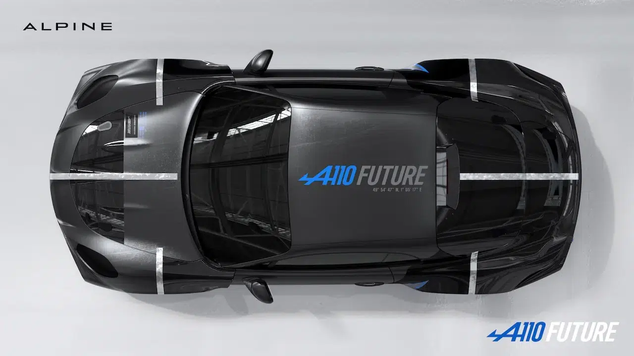 Top-down view of a black Alpine A110 Future concept car with white racing stripes and blue A110 Future branding on the hood; Alpine logo in the top-left.